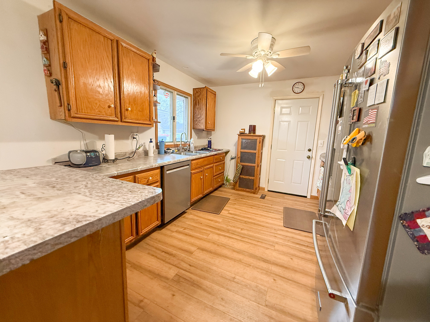 802 East 19th Street Sterling, IL 61081 - Photo 11 of 29 a kitchen with stainless steel appliances granite countertop a sink stove and refrigerator