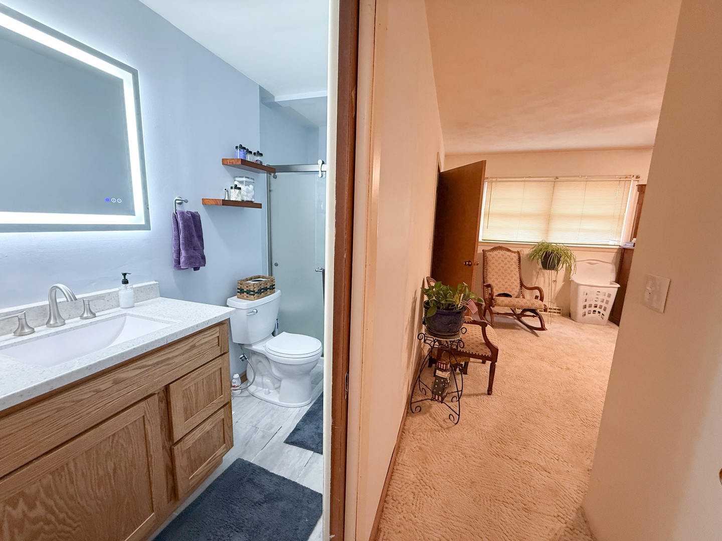 802 East 19th Street Sterling, IL 61081 - Photo 18 of 29 a view of a bathroom with a sink and mirror