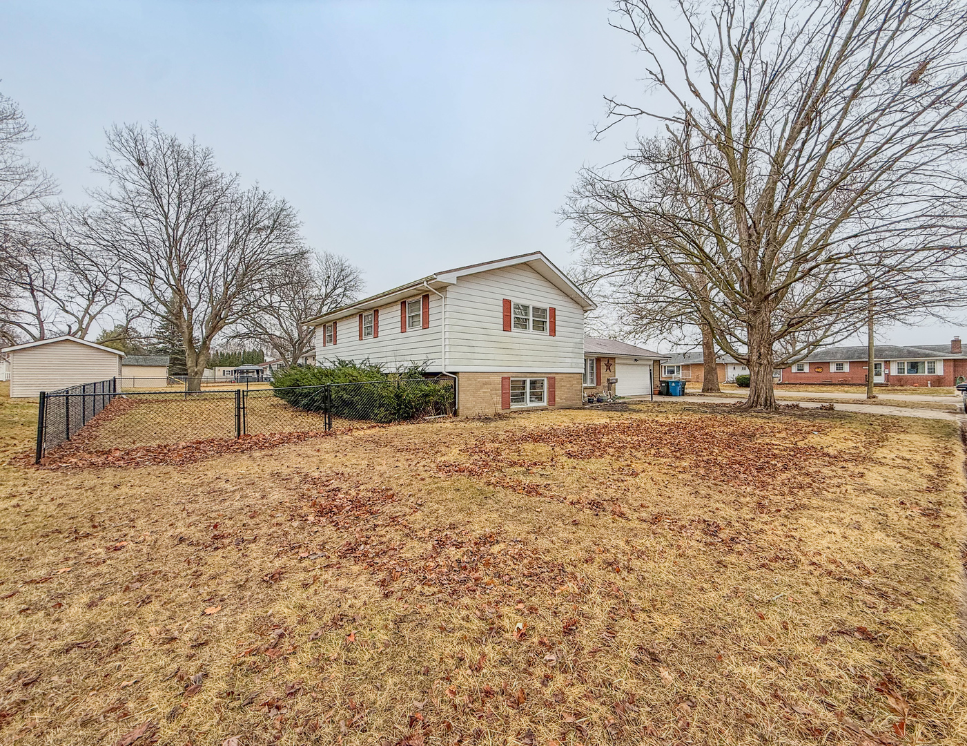 802 East 19th Street Sterling, IL 61081 - Photo 2 of 29 a view of white house with a yard and tree s