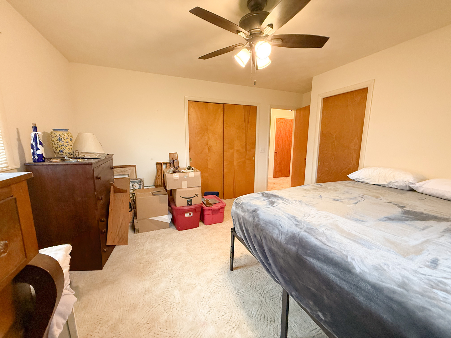 802 East 19th Street Sterling, IL 61081 - Photo 21 of 29 a bed room with a bed and a chandelier