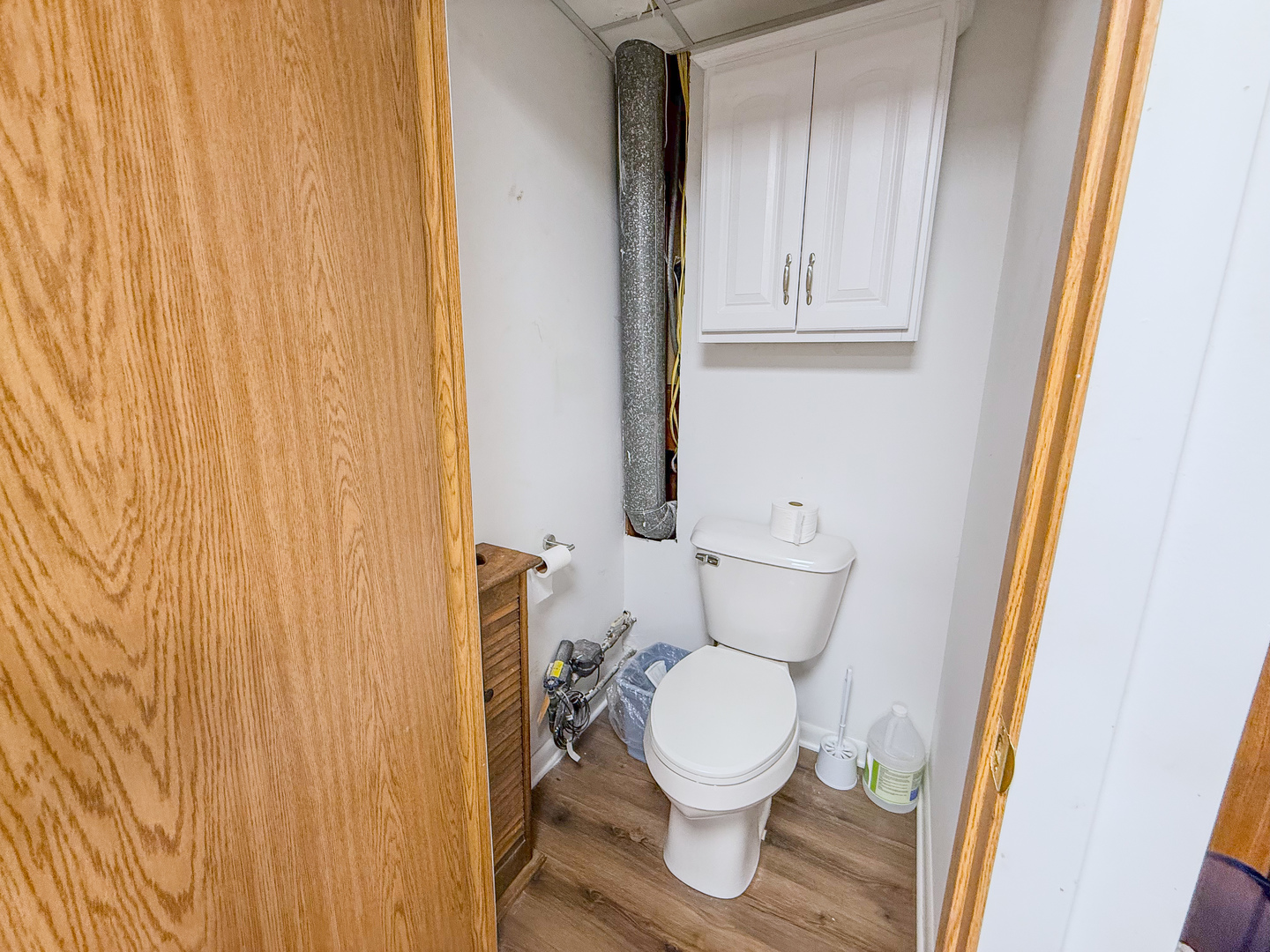 802 East 19th Street Sterling, IL 61081 - Photo 28 of 29 a white toilet sitting next to a shower curtain