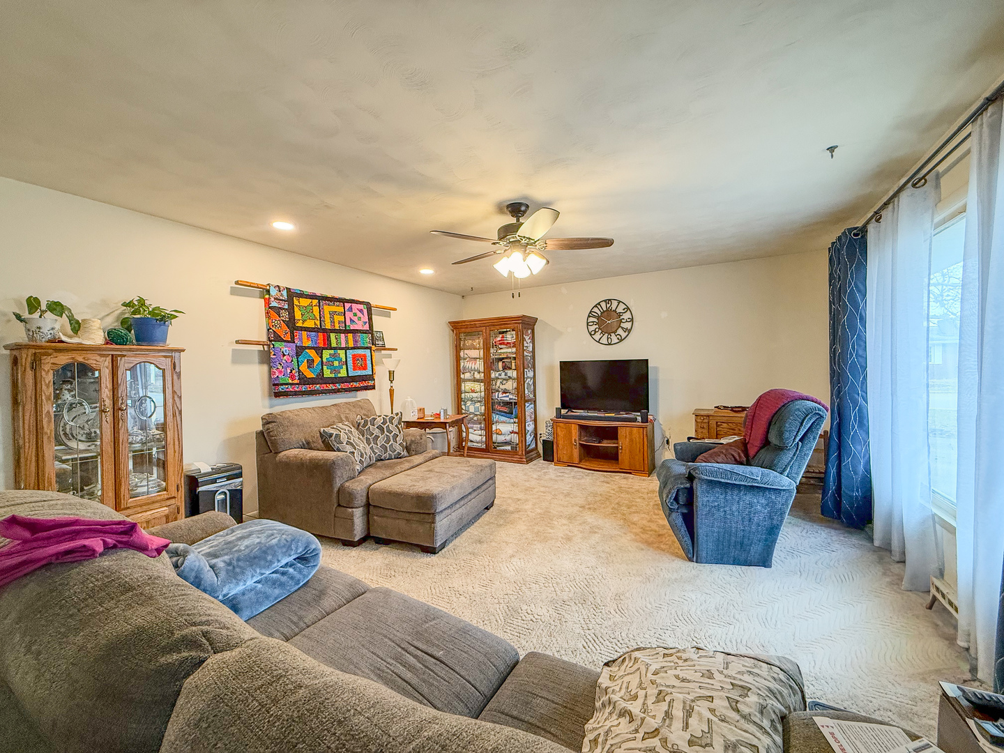 802 East 19th Street Sterling, IL 61081 - Photo 5 of 29 a living room with furniture and a chandelier