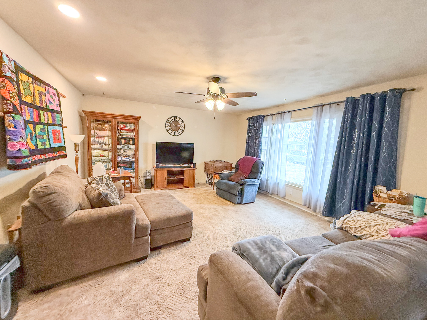 802 East 19th Street Sterling, IL 61081 - Photo 6 of 29 a living room with furniture a fireplace and a flat screen tv