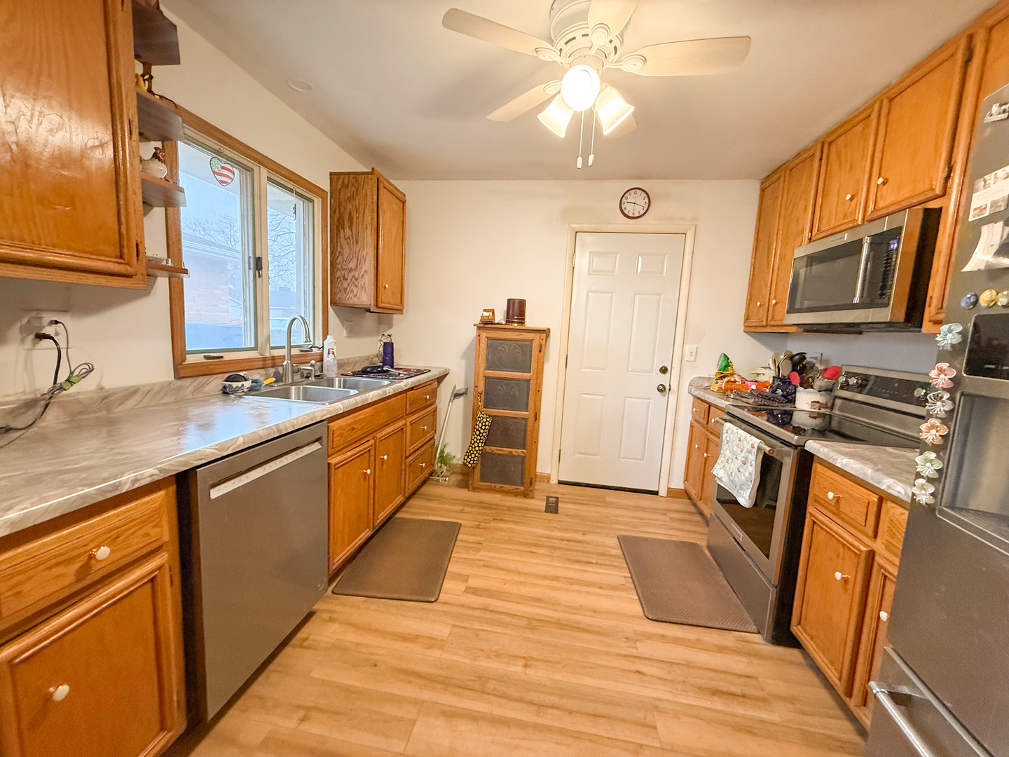 802 East 19th Street Sterling, IL 61081 - Photo 8 of 29 a kitchen with stainless steel appliances granite countertop a sink stove and refrigerator