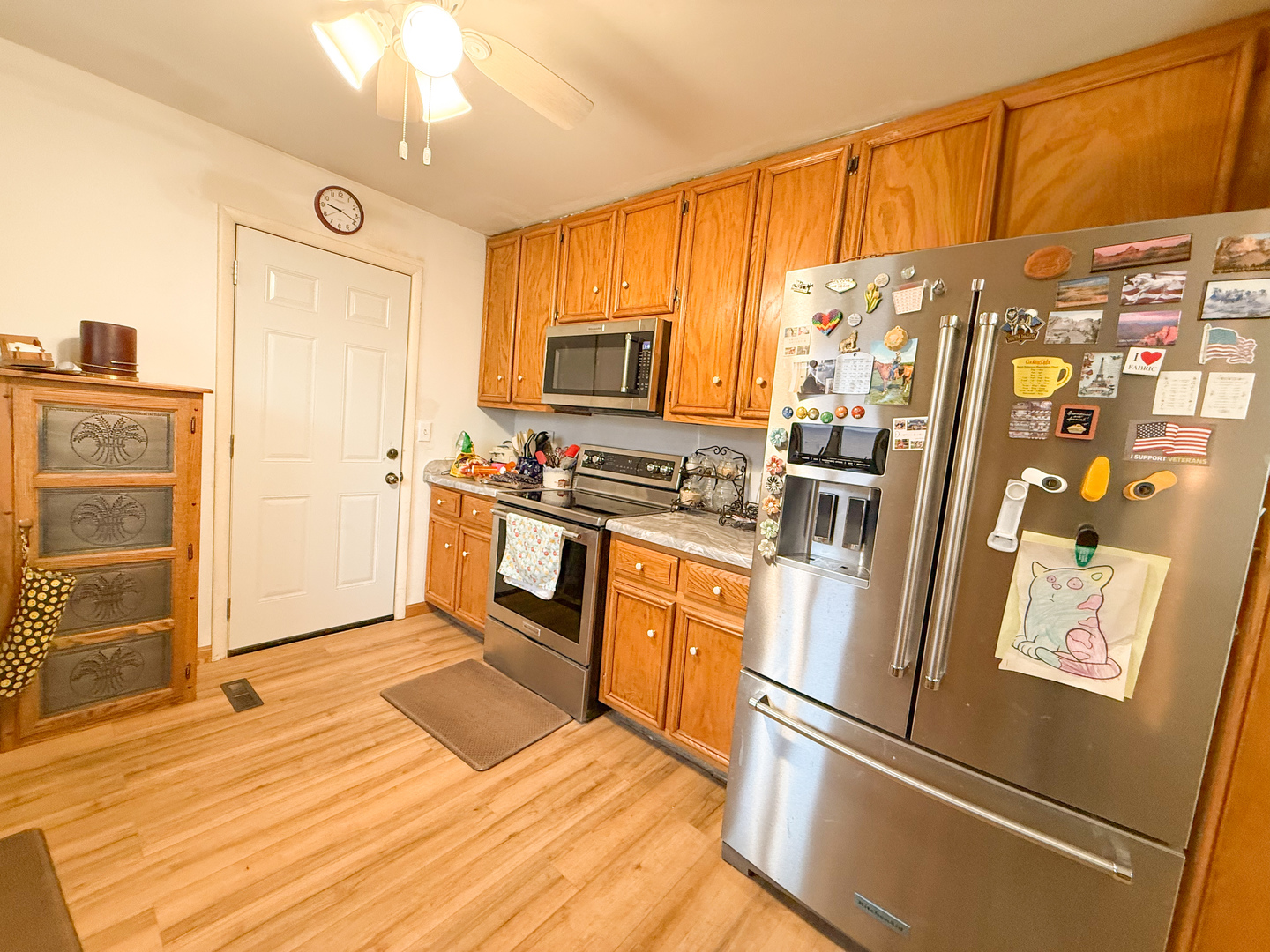 802 East 19th Street Sterling, IL 61081 - Photo 9 of 29 a kitchen with stainless steel appliances granite countertop a refrigerator a stove and a sink with cabinets
