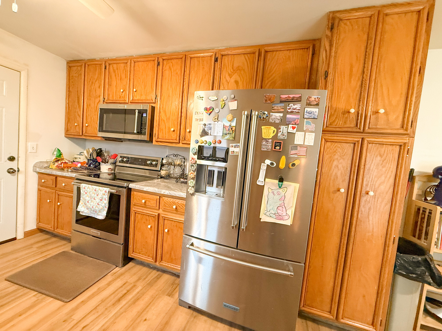 802 East 19th Street Sterling, IL 61081 - Photo 10 of 29 a kitchen with stainless steel appliances a refrigerator sink and cabinets