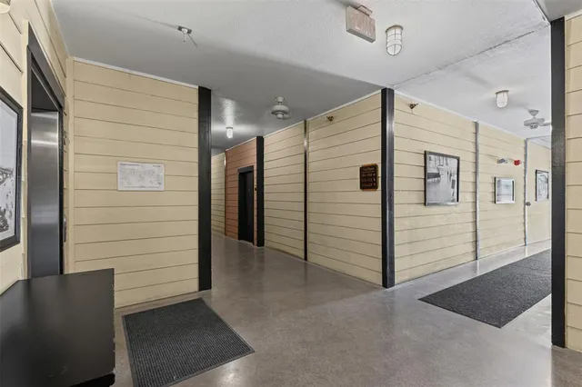 a view of a hallway with seating area