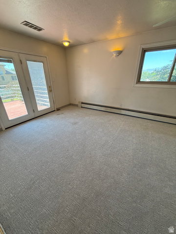 328 Heather Ridge Circle Sandy, UT 84070 - Photo 8 of 32 Interior room with light-toned walls and patterned carpeting