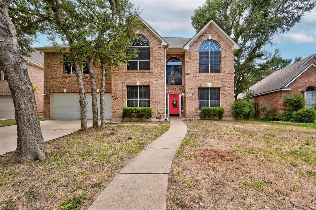 1909 Springwater Drive Round Rock, TX 78681 - Photo 1 of 34 Traditional home with brick siding, concrete driveway, a garage, and a front yard