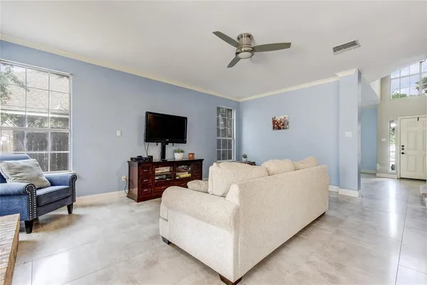a living room with furniture and a flat screen tv
