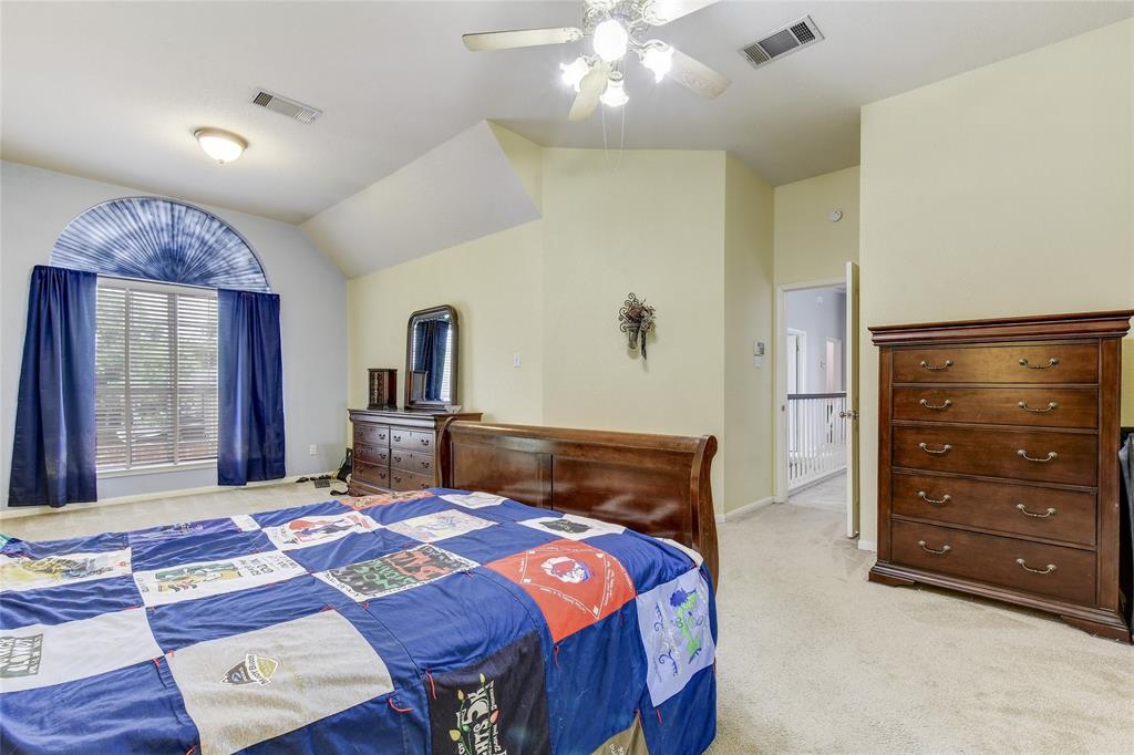 1909 Springwater Drive Round Rock, TX 78681 - Photo 25 of 34 Bedroom with light colored carpet, ceiling fan, and lofted ceiling