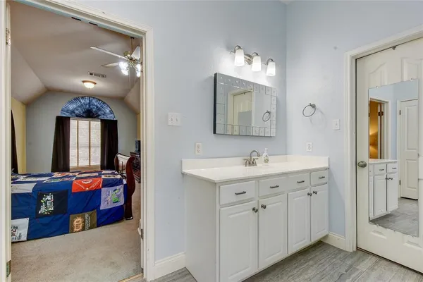 a bathroom with 2 sink tub and a mirror
