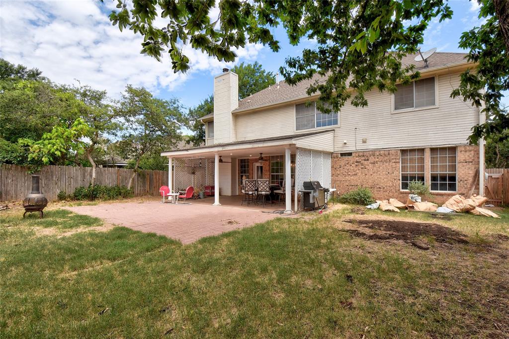 1909 Springwater Drive Round Rock, TX 78681 - Photo 33 of 34 Rear view of property featuring a fenced backyard, a patio, brick siding, and a chimney
