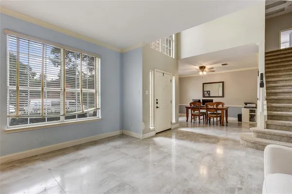 a view of a livingroom with furniture and a window