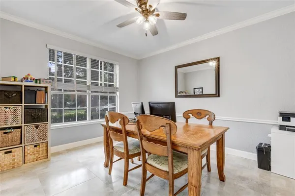 a dining room with furniture and window