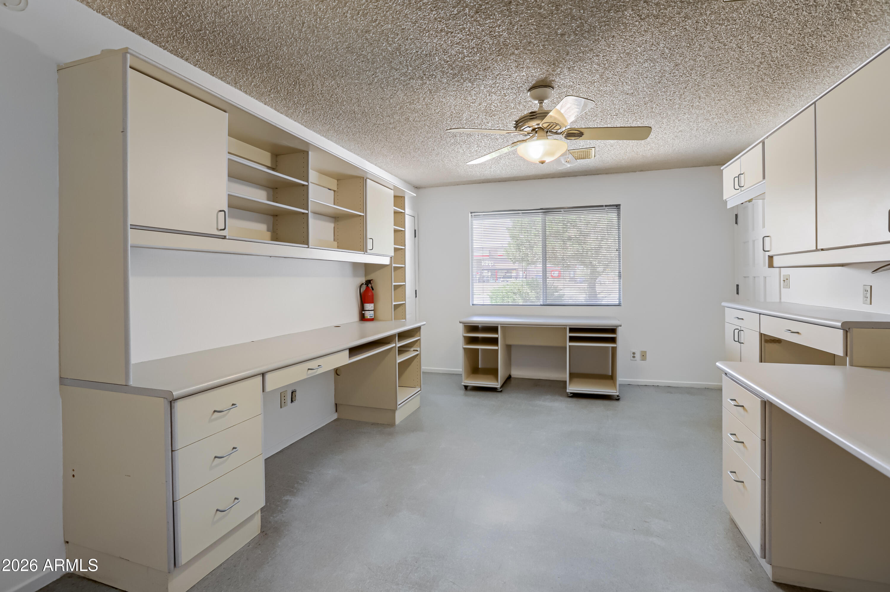 3823 West Greenway Road Phoenix, AZ 85053 - Photo 13 of 28 a kitchen that has a lot of cabinets in it