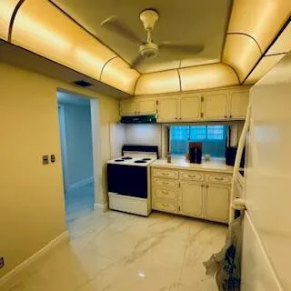 a kitchen that has a sink and a stove