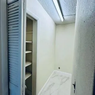 a view of a balcony with chairs