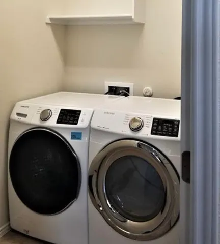 a utility room with dryer and washer