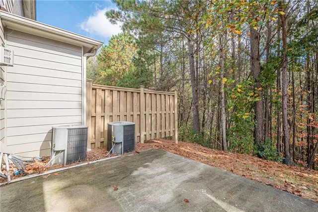 a view of backyard with deck and outdoor space