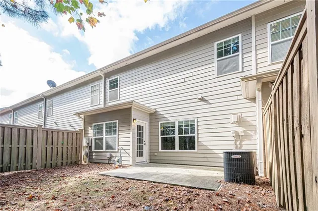 a front view of a house with a chair