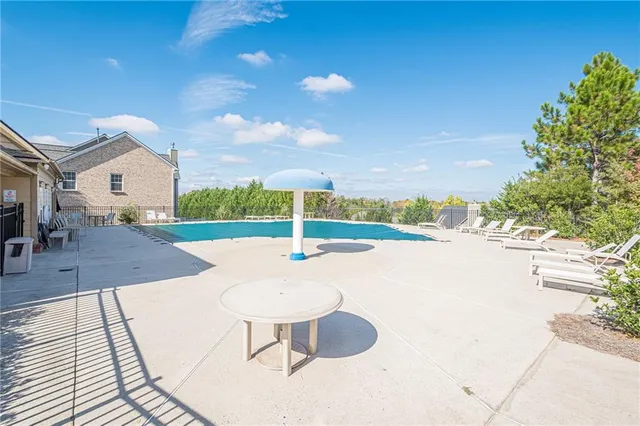 a view of a terrace with wooden floor and a yard