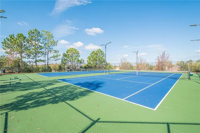 a view of an outdoor space and basketball court