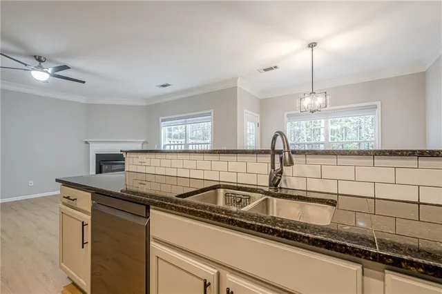 a kitchen with a sink and cabinets