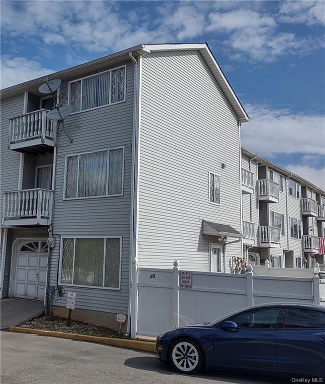 a front view of a house with parking
