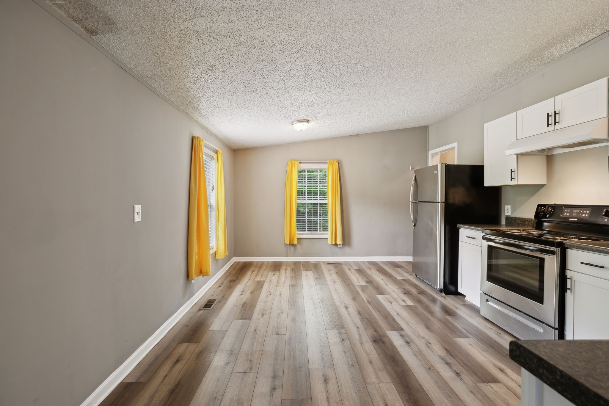2201 Mt Pleasant Cemetery Road Primm Springs, TN 38476 - Photo 13 of 36 a view of a kitchen with a stove cabinets and wooden floor