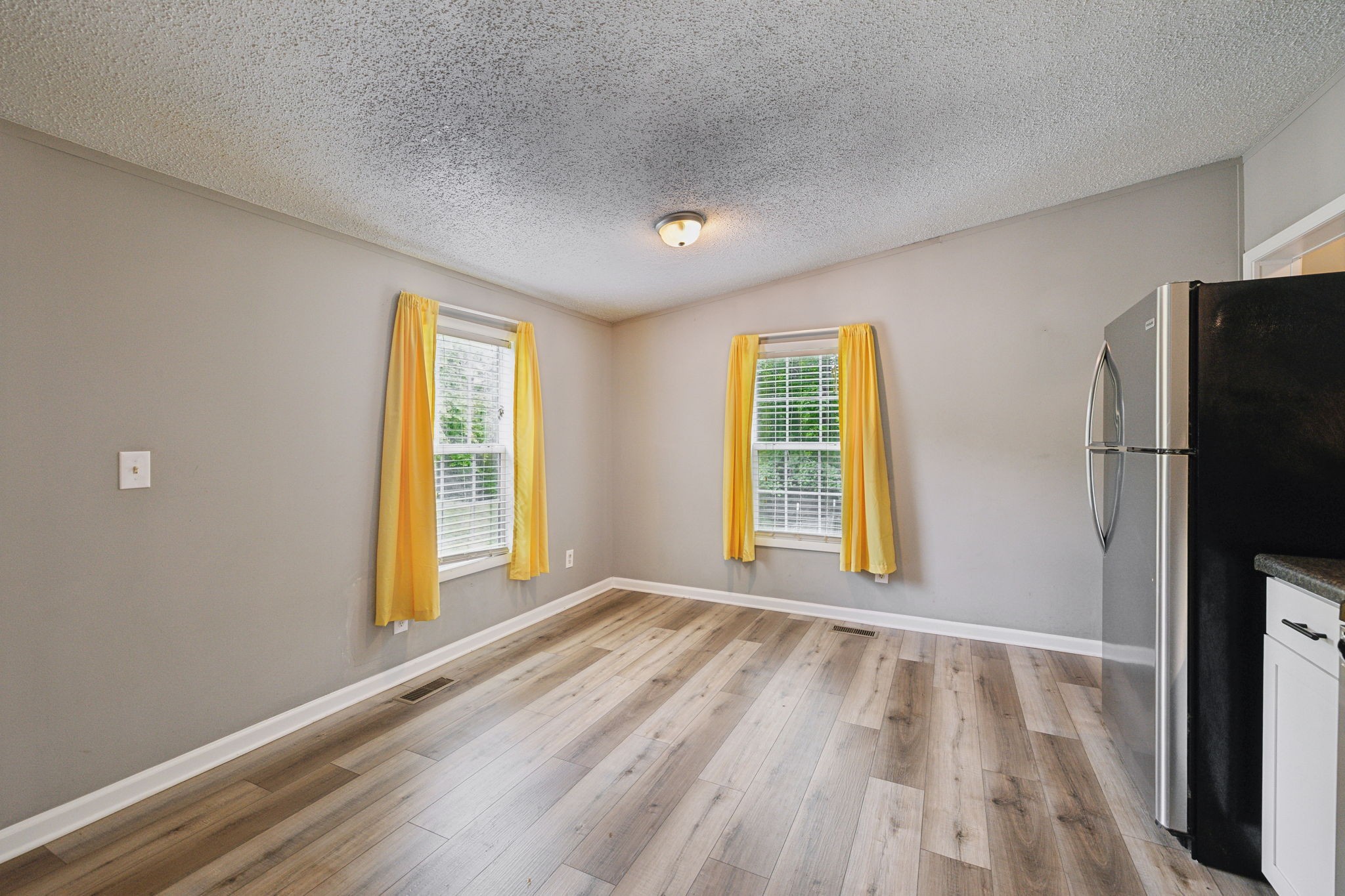 2201 Mt Pleasant Cemetery Road Primm Springs, TN 38476 - Photo 15 of 36 a view of an empty room with a window and a kitchen