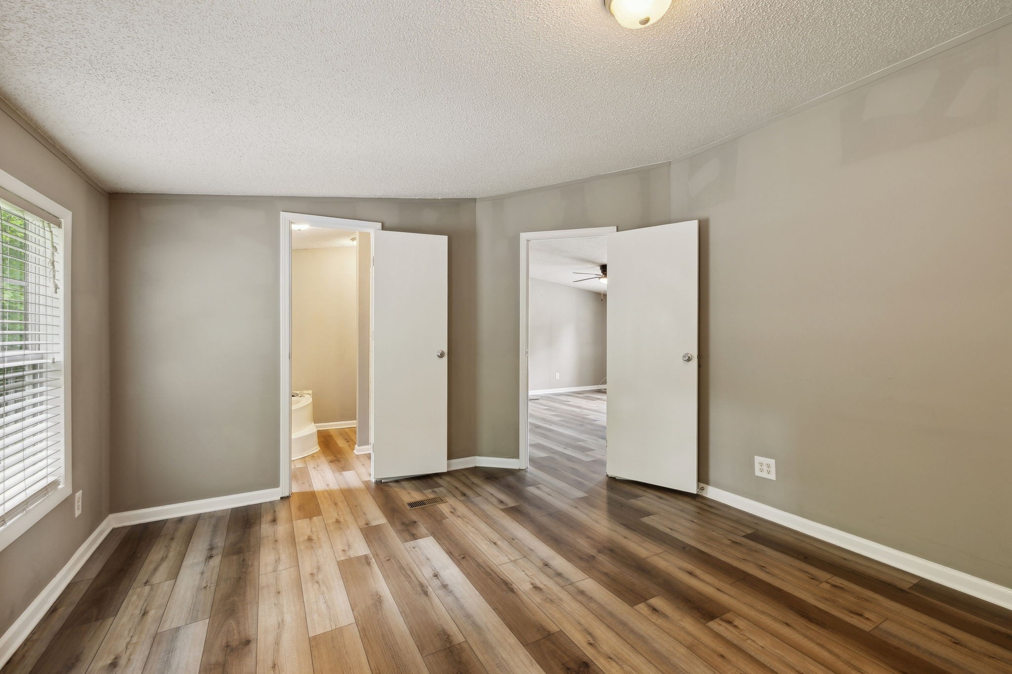 2201 Mt Pleasant Cemetery Road Primm Springs, TN 38476 - Photo 18 of 36 an empty room with wooden floor and windows