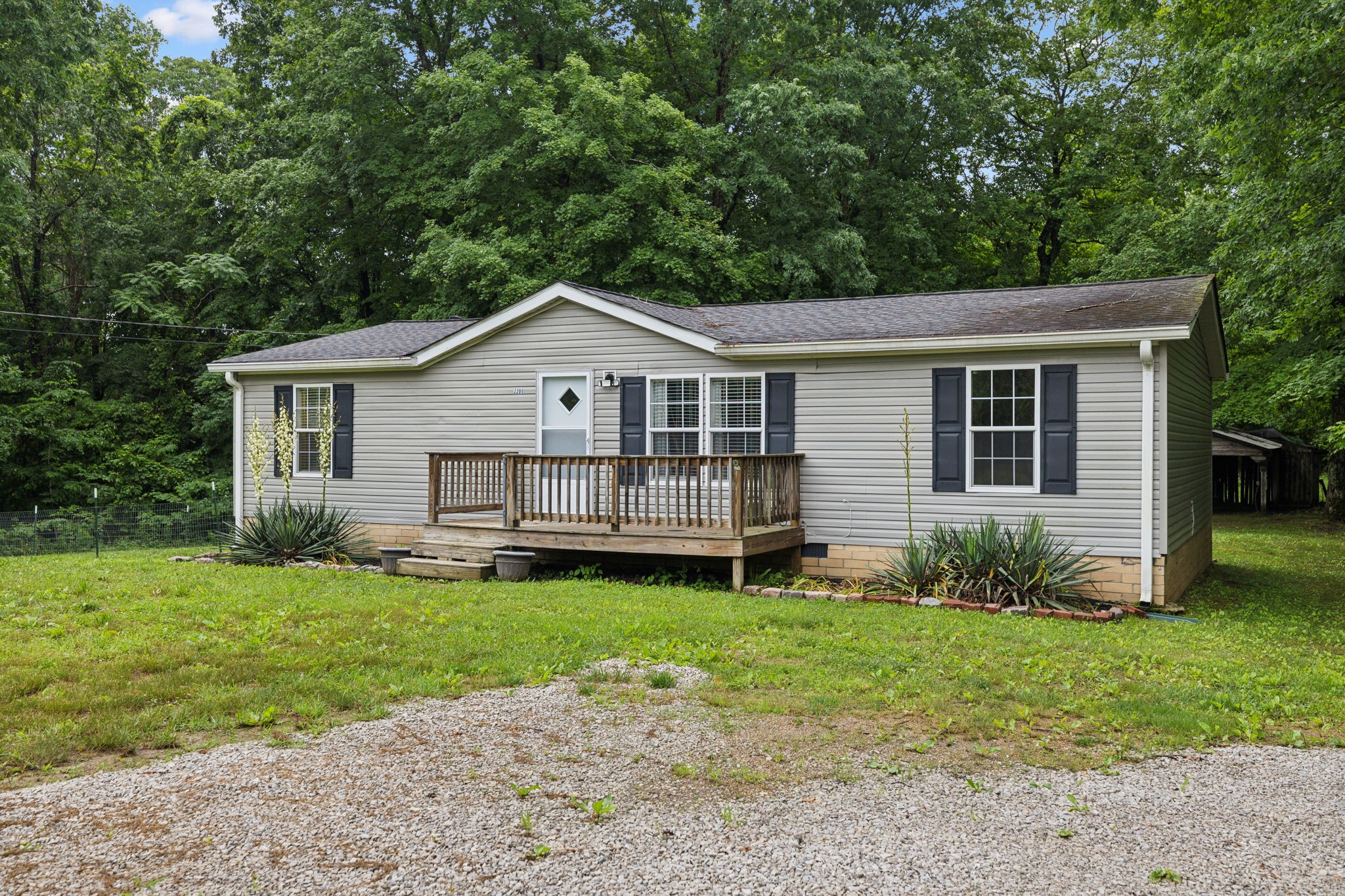 2201 Mt Pleasant Cemetery Road Primm Springs, TN 38476 - Photo 2 of 36 a view of a house with a yard and plants