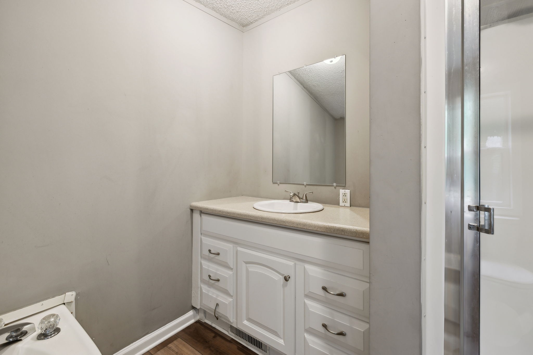 2201 Mt Pleasant Cemetery Road Primm Springs, TN 38476 - Photo 21 of 36 a bathroom with a sink and a mirror