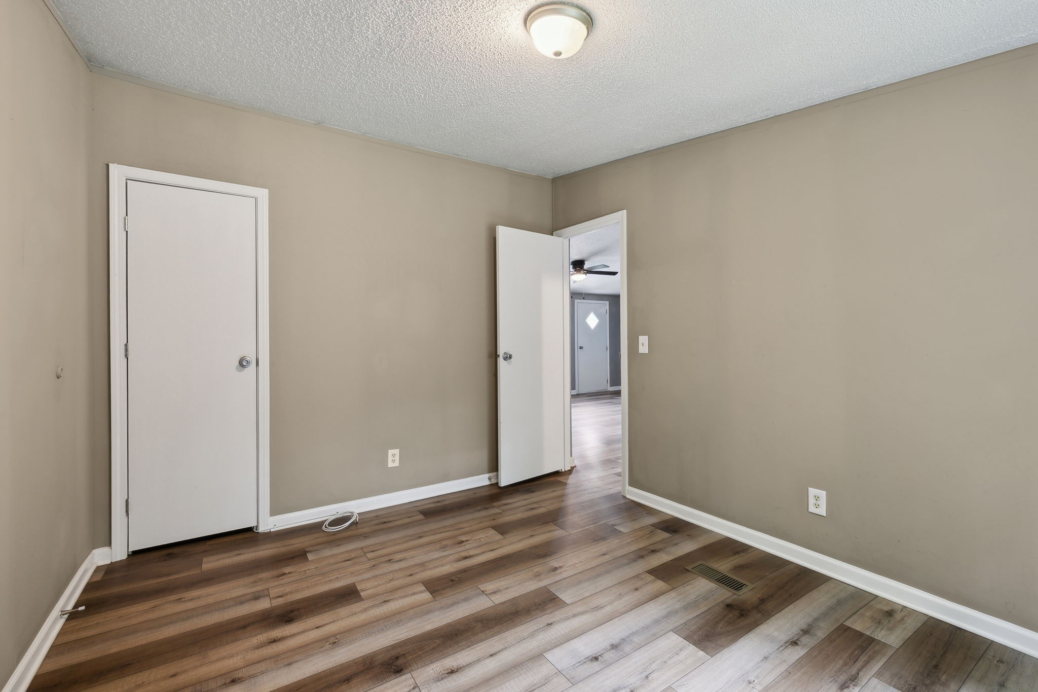 2201 Mt Pleasant Cemetery Road Primm Springs, TN 38476 - Photo 23 of 36 an empty room with wooden floor and windows