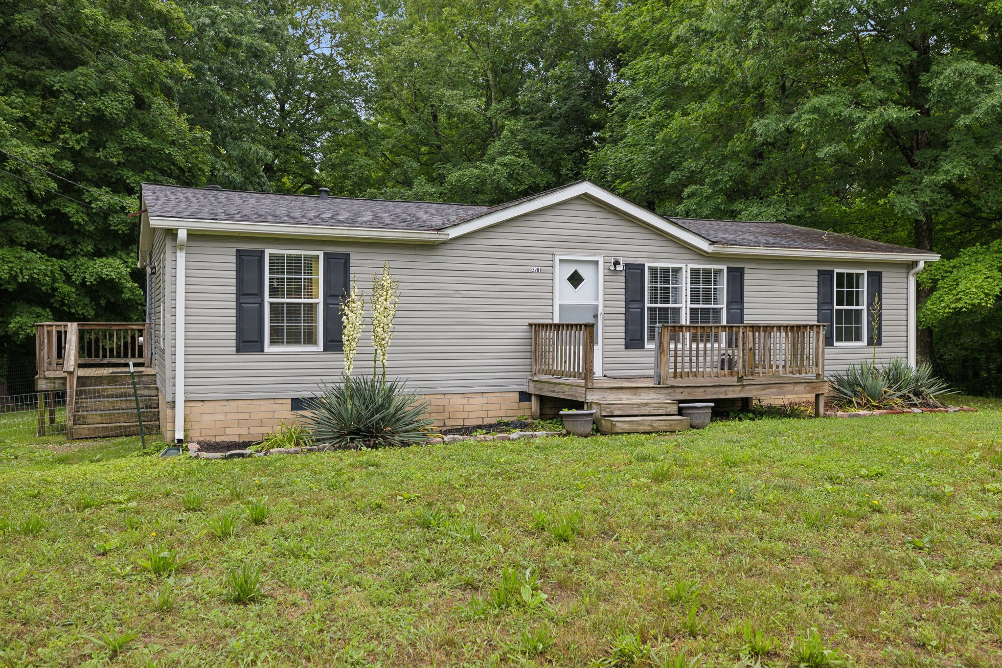 2201 Mt Pleasant Cemetery Road Primm Springs, TN 38476 - Photo 3 of 36 a view of a house with a yard and sitting area