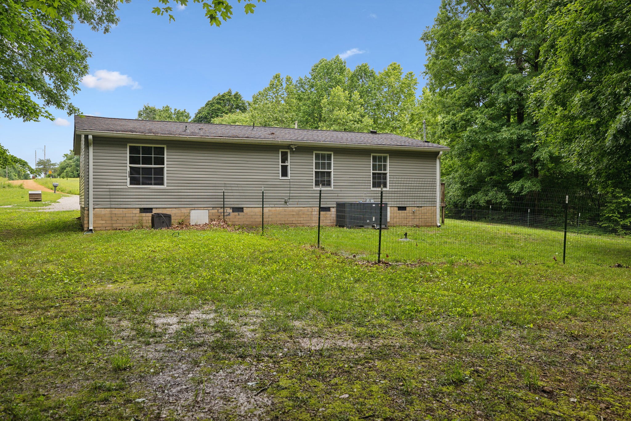 2201 Mt Pleasant Cemetery Road Primm Springs, TN 38476 - Photo 31 of 36 a view of a house with a yard
