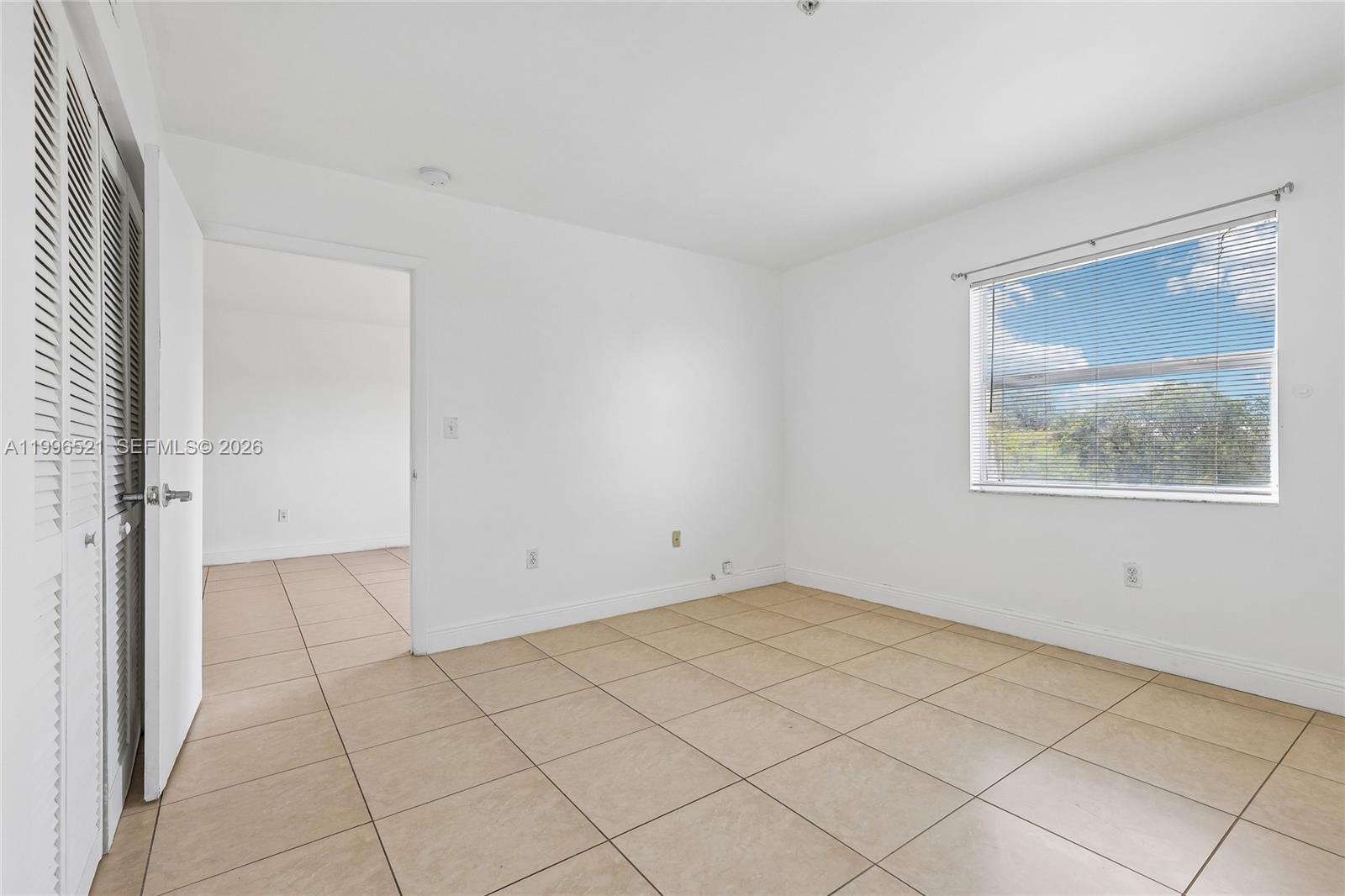 4137 Stirling Road, Unit 507 Dania Beach, FL 33314 - Photo 11 of 20 an empty room with a window