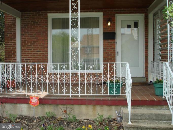 6110 Dunroming Road Baltimore, MD 21239 - Photo 11 of 11 a view of wooden door with a yard