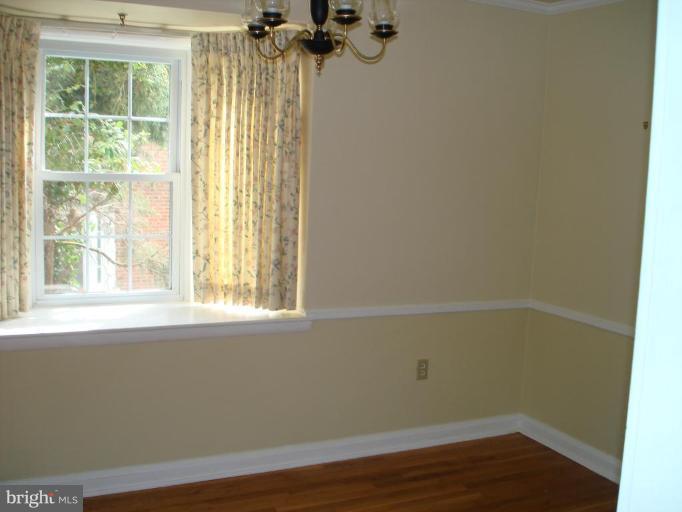 6110 Dunroming Road Baltimore, MD 21239 - Photo 5 of 11 an empty room with a window