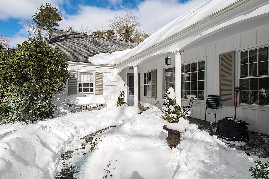 155 Michigan Road New Canaan, CT 06840 - Photo 2 of 40 a view of a house with a patio