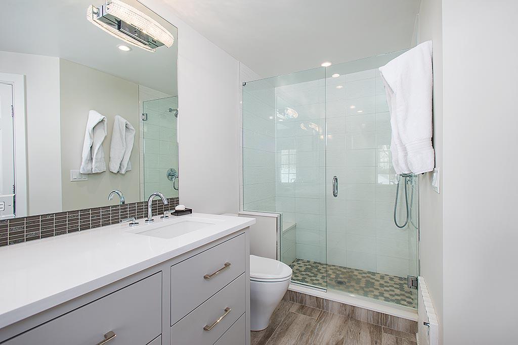 155 Michigan Road New Canaan, CT 06840 - Photo 15 of 40 a bathroom with a double vanity sink toilet and shower