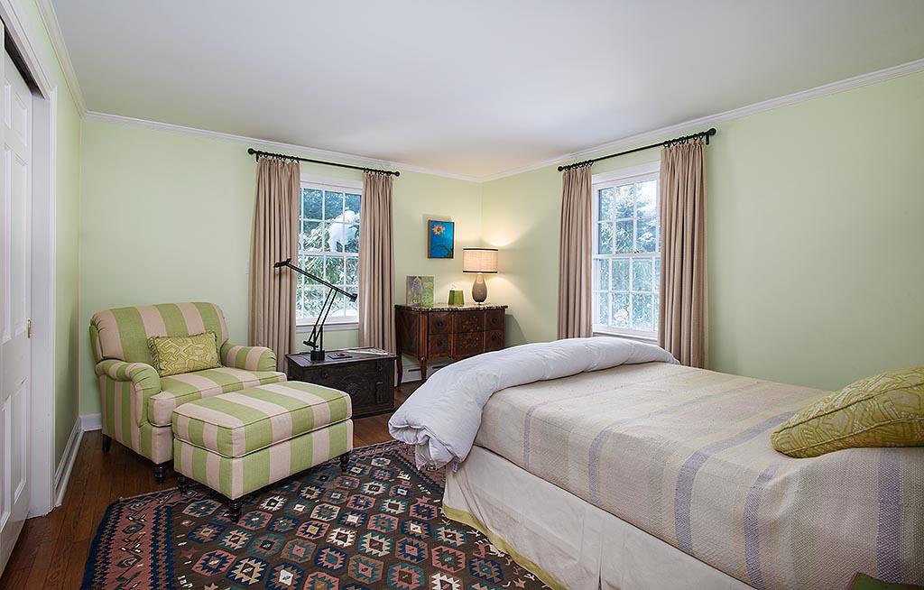 155 Michigan Road New Canaan, CT 06840 - Photo 16 of 40 a bedroom with a bed couch and a window