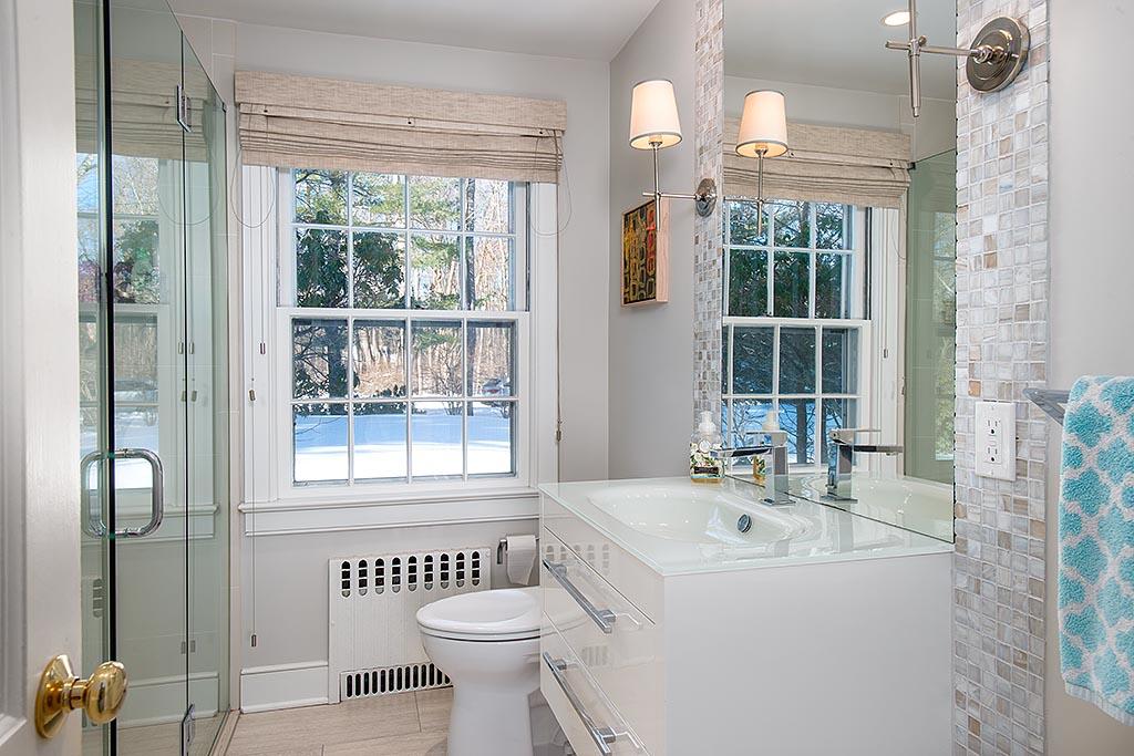 155 Michigan Road New Canaan, CT 06840 - Photo 17 of 40 a bathroom with a sink a toilet and shower