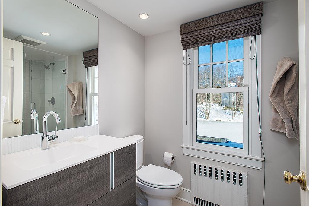 155 Michigan Road New Canaan, CT 06840 - Photo 19 of 40 a bathroom with a sink a toilet and shower