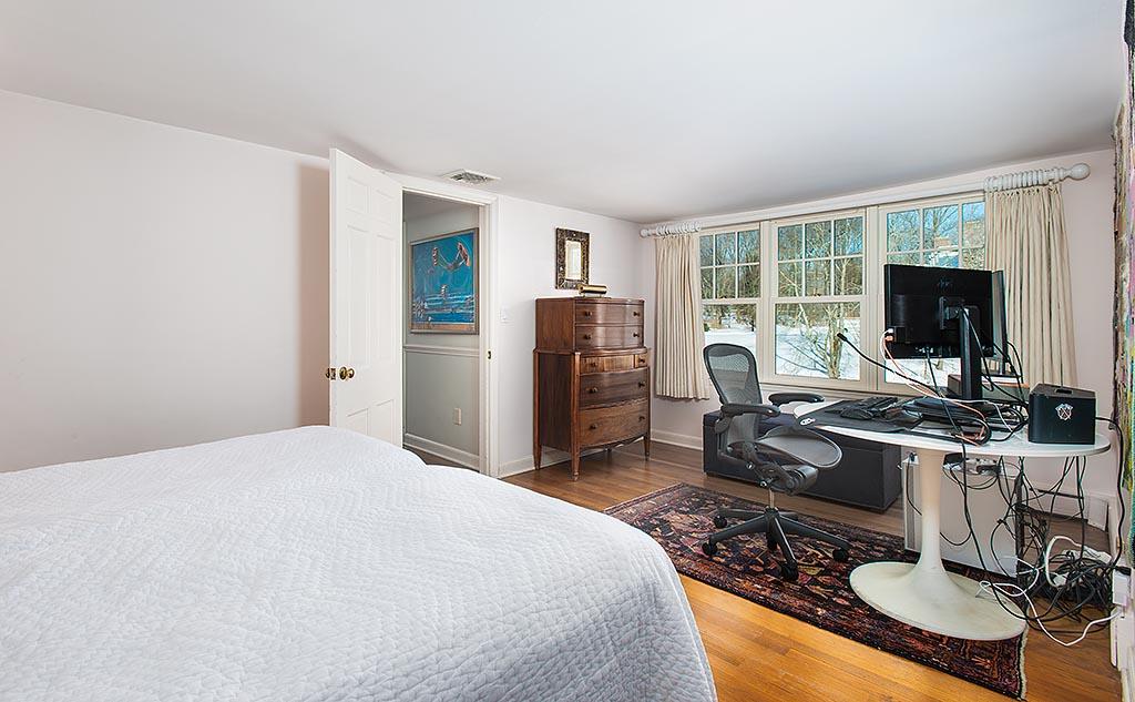 155 Michigan Road New Canaan, CT 06840 - Photo 20 of 40 a living room with furniture a flat screen tv and a window