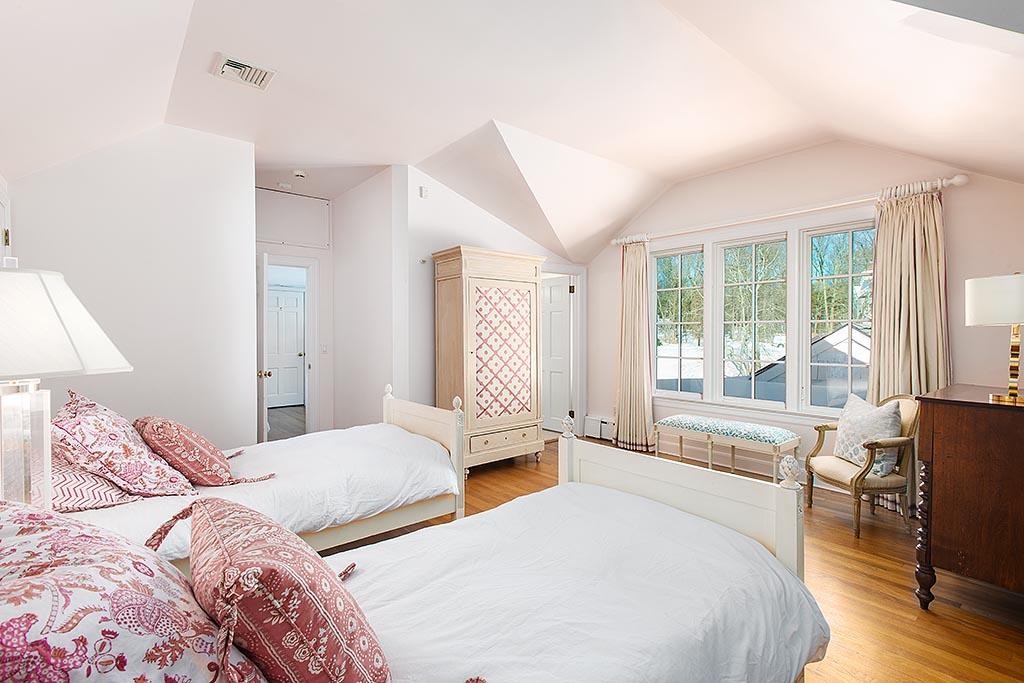 155 Michigan Road New Canaan, CT 06840 - Photo 21 of 40 a bedroom with a large bed and a large window