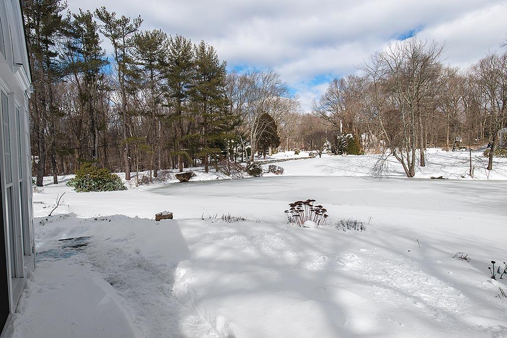 155 Michigan Road New Canaan, CT 06840 - Photo 23 of 40 a view of a snow on the side of the road