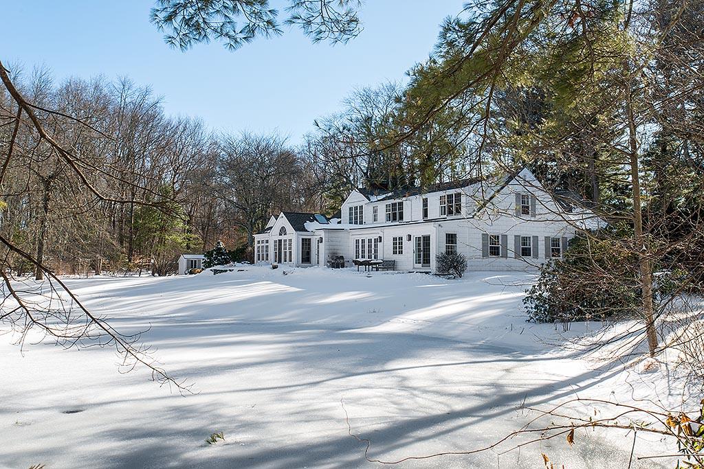 155 Michigan Road New Canaan, CT 06840 - Photo 25 of 40 a view of a house with a yard