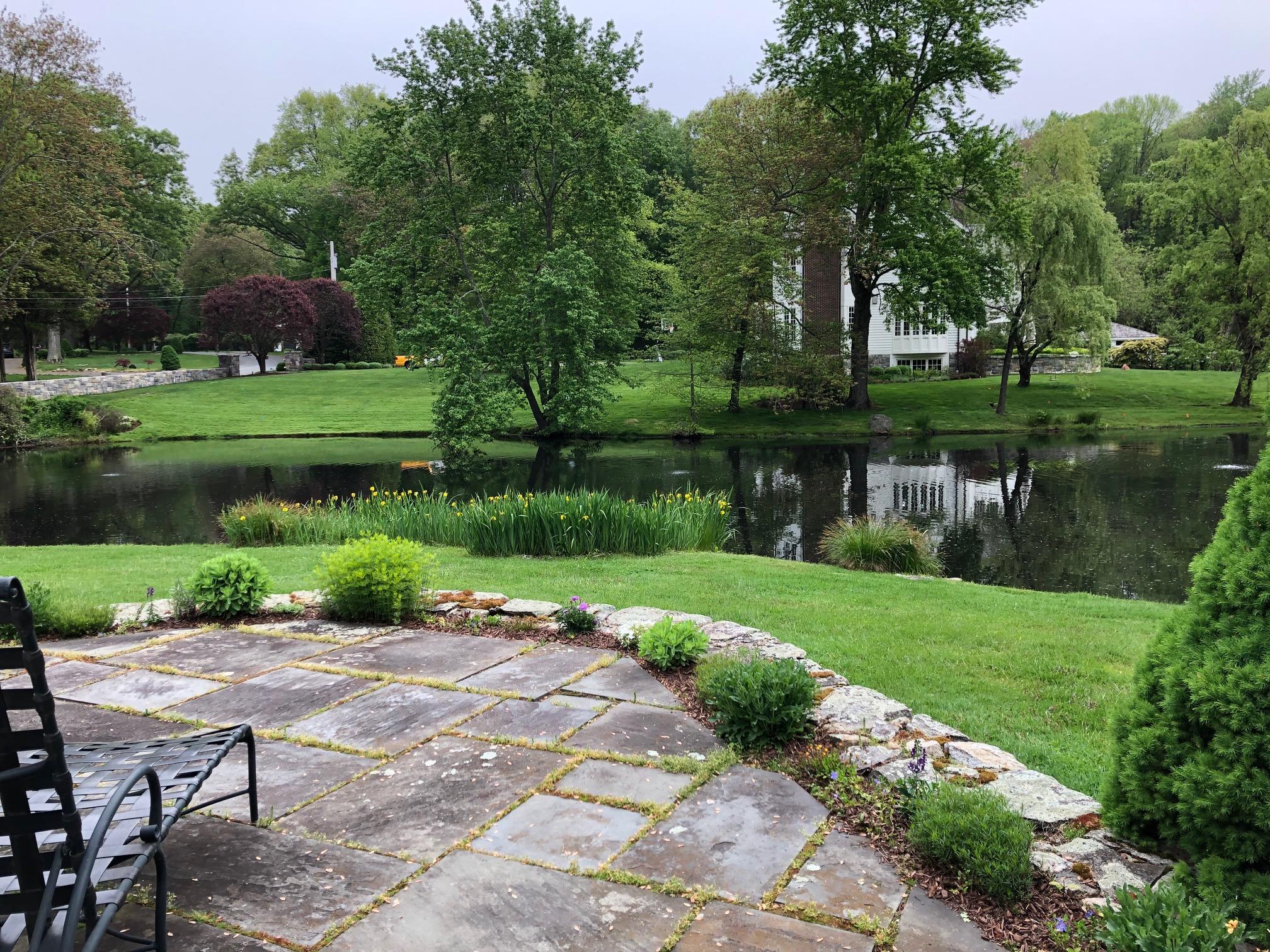 155 Michigan Road New Canaan, CT 06840 - Photo 27 of 40 a view of a park with bench and trees around